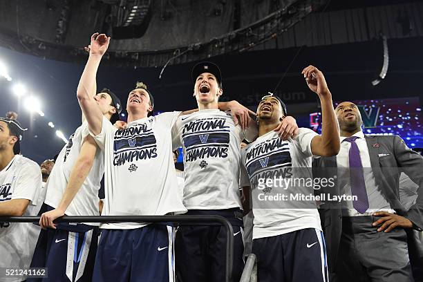 Patrick Farrell, Ryan Arcidiacono, and Phil Booth of the Villanova Wildcats celebrate winning after the NCAA College Basketball Tournament...