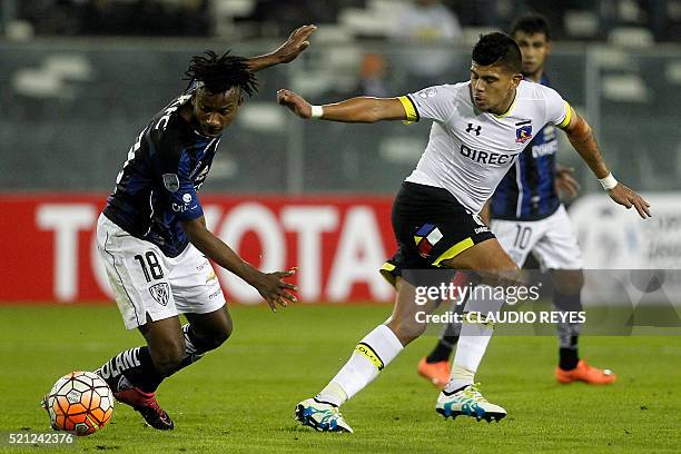 Ecuador's Independiente del Valle player Jefferson Orejuela vies for the ball with of Chile's Colo Colo Esteban Pavez during their Copa Libertadores...