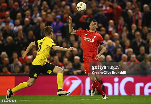 Dejan Lovren of Liverpool in action with Lukasz Piszczek of Borussia Dortmund uring the UEFA Europa League quarter final second leg match between...