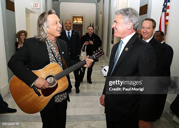 Singer-songwriter Jim Lauderdale talks with Rep. Michael McCaul during GRAMMYs on The Hill Advocacy Day on Capitol Hill on April 14, 2016 in...