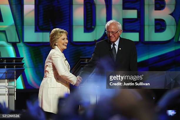 Democratic Presidential candidates Hillary Clinton and Sen. Bernie Sanders shake hands before the CNN Democratic Presidential Primary Debate at the...