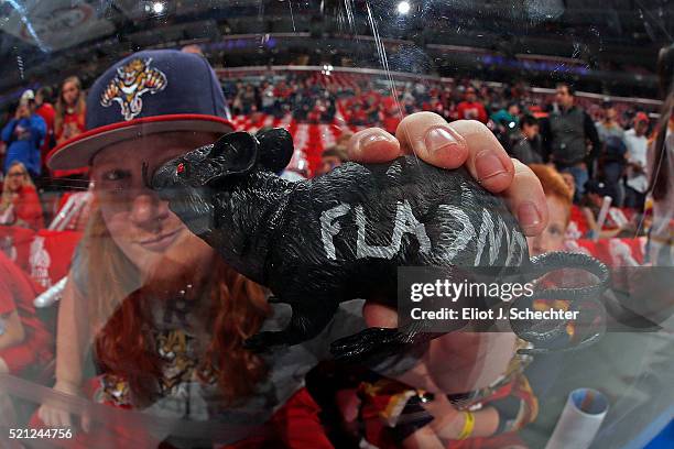 Florida Panthers fan holds up a victory rat prior to the start of the game against the New York Islanders in Game One of the Eastern Conference...