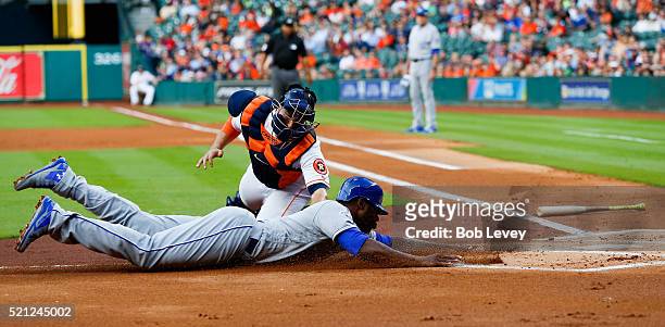 Jason Castro of the Houston Astros tags out Lorenzo Cain of the Kansas City Royals trying to scvore in the first inning at Minute Maid Park on April...