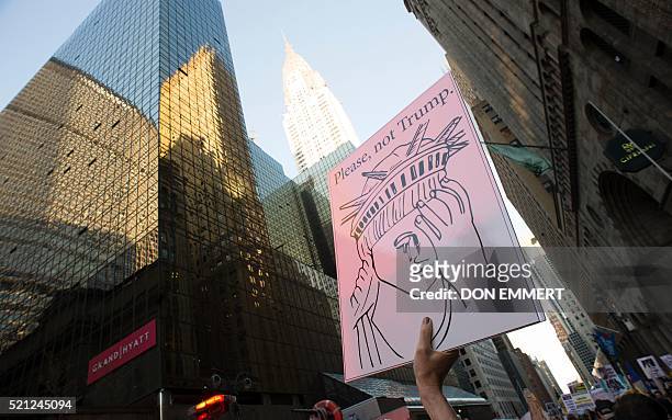 Protesters gather near Grand Central Station to protest against US Republican presidential candidate Donald Trump who was attending a New York GOP...