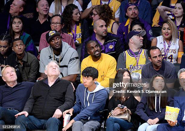 Lamar Odom and Kanye West attend Kobe Bryant's final game between the Utah Jazz and the Los Angeles Lakers at Staples Center on April 13, 2016 in Los...