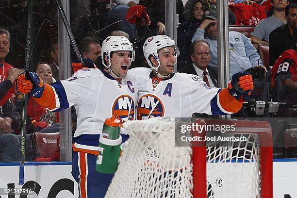 John Tavares celebrates his second period goal with Frans Nielsen of the New York Islanders against the Florida Panthers in Game One of the Eastern...