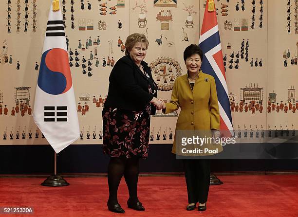 Norwegian Prime Minister Erna Solberg shakes hands with South Korean President Park Geun-Hye during a meeting at the presidential house on April 15,...