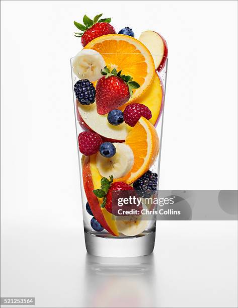 fruit salad in tall glass - fruit salad stock pictures, royalty-free photos & images