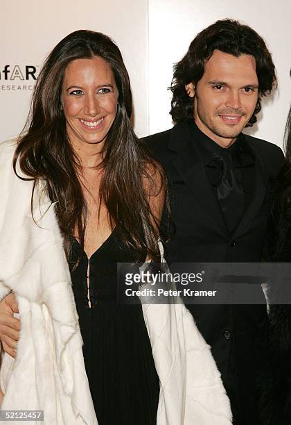 Gabby Karan and husband attend the amfar and ACRIA gala benefit honoring photographer Herb Ritts on February 2, 2005 in New York City.