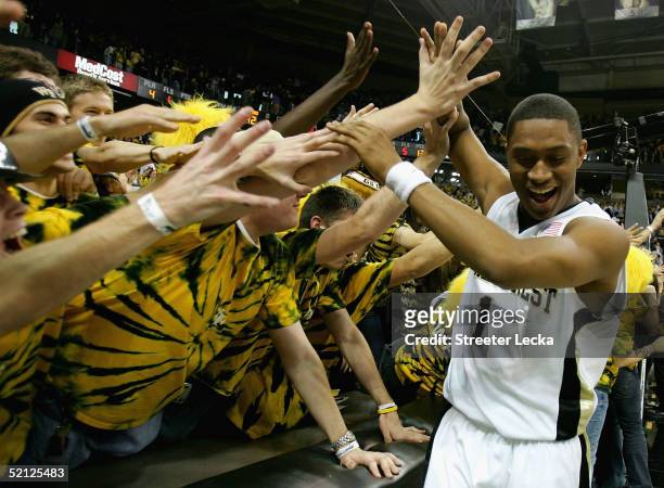 Justin Gray of the Wake Forest Demon Deacons celebrates with fans after their victory over the Duke Blue Devils during their game on February 2, 2005...