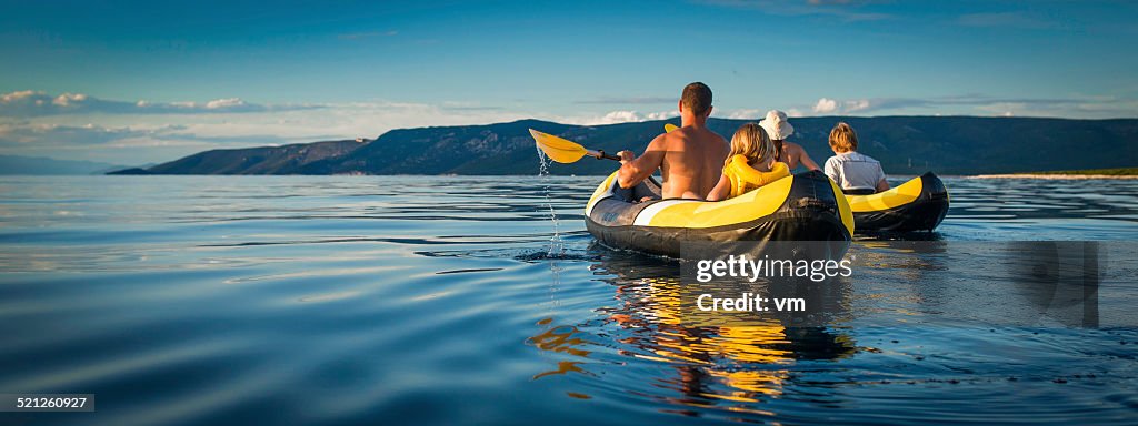 Family Sea Kayaking on a Sunny Day