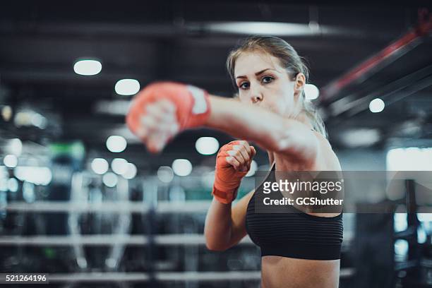 warming up for a boxing match - girl punch stock pictures, royalty-free photos & images