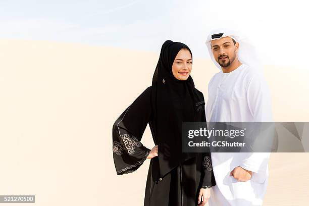 arab couple in the desert - emirati couple stock pictures, royalty-free photos & images