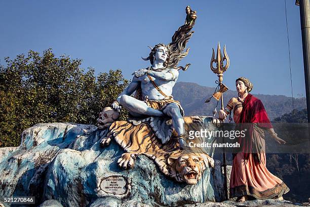 lord shiva and goddess parvati statue's in rishikesh. - rishikesh meditation stock pictures, royalty-free photos & images