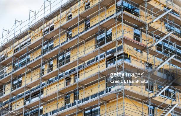 thermal insulation on building facade - scaffolding bildbanksfoton och bilder