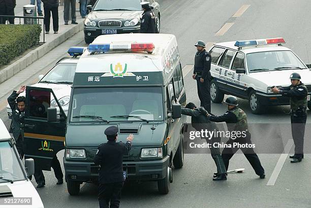 Subdue Images Chinese Criminals Photos and Premium High Res Pictures - Getty Images