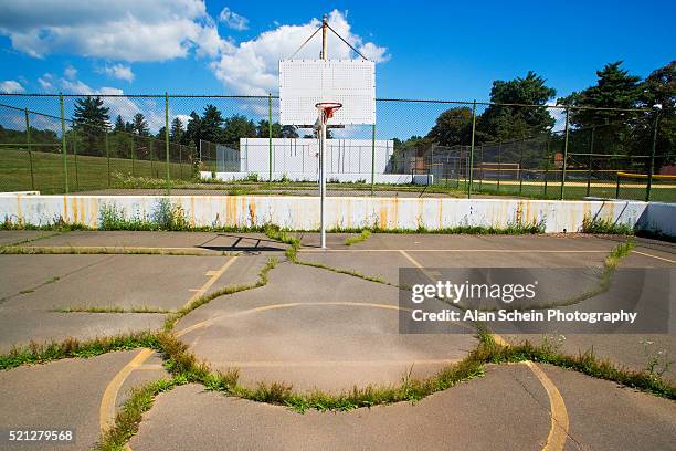 decrepit basketball court - old basketball hoop stock pictures, royalty-free photos & images