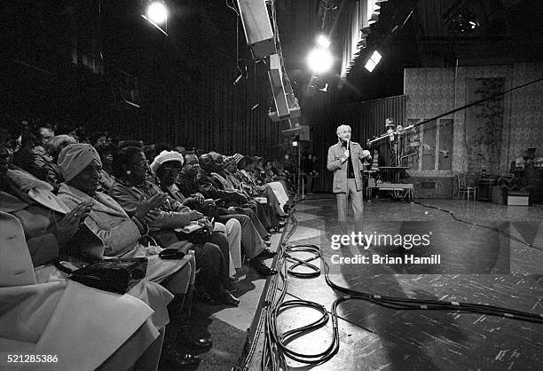 American television producer and writer Norman Lear stands on the set of his tv 'The Jeffersons' as he talks with the studio audience, Los Angeles,...