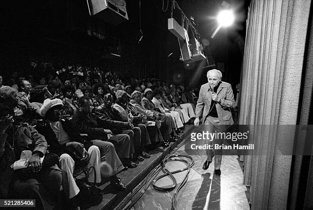 American television producer and writer Norman Lear stands on the set of his tv 'The Jeffersons' as he talks with the studio audience, Los Angeles,...