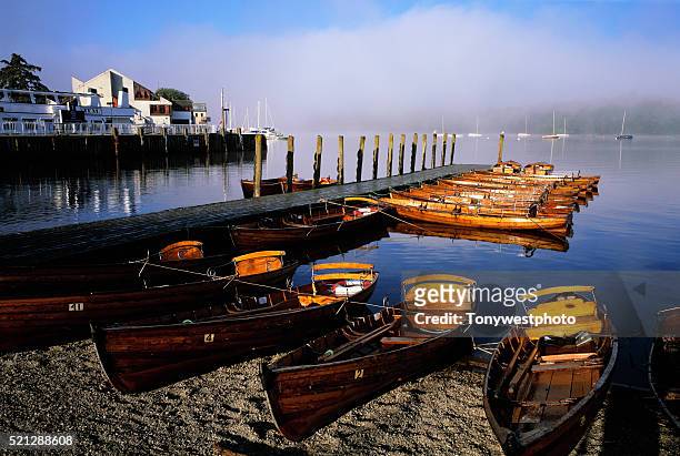 moored rowboats on lake windermere - lake windermere stock-fotos und bilder