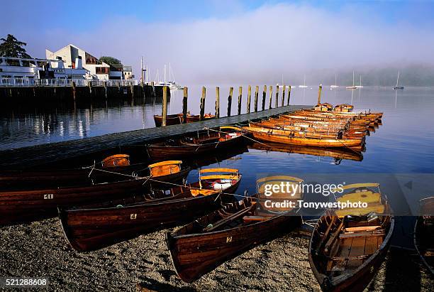 moored rowboats on lake windermere - lake windermere foto e immagini stock