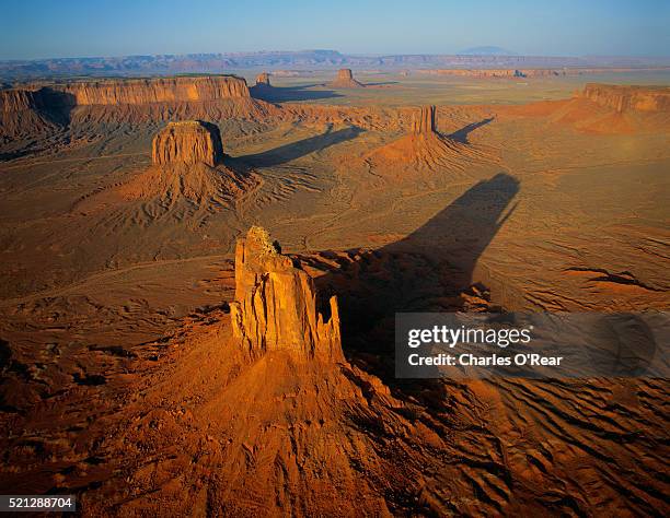 over monument valley at sunrise - butte rocky outcrop stock pictures, royalty-free photos & images