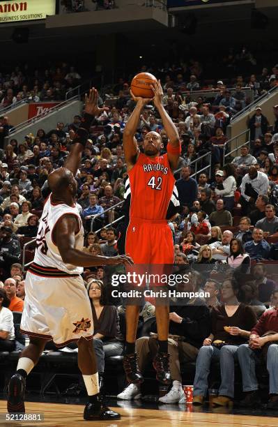 Donyell Marshall of the Toronto Raptors shoots against Marc Jackson of the Philadelphia 76ers on January 14, 2005 at the Wachovia Center in...