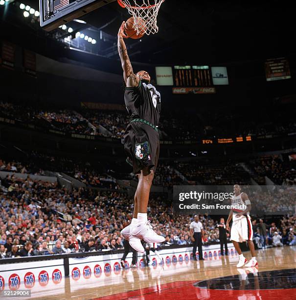 Troy Hudson of the Minnesota Timberwolves takes the ball to the basket during the game against the Portland Trail Blazers at The Rose Garden on...