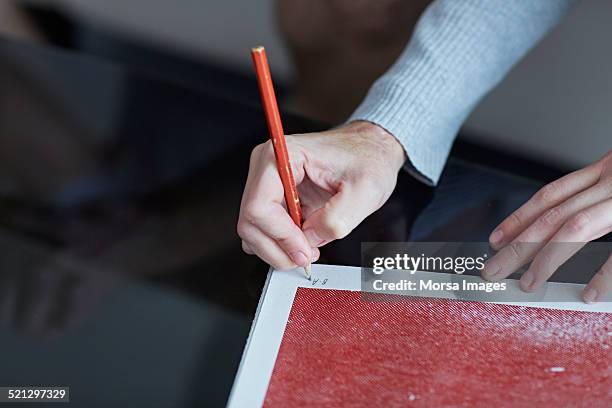 woman signing a silk screen print - silk screen stock pictures, royalty-free photos & images