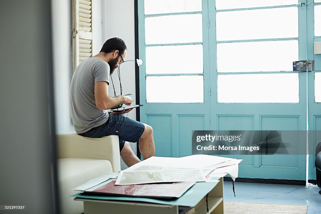 Man using a tablet at his studio