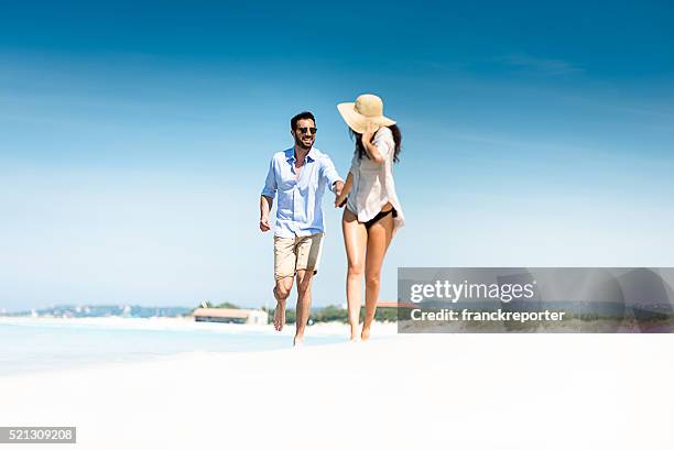 happiness couple at the seaside - carribean beach stock pictures, royalty-free photos & images