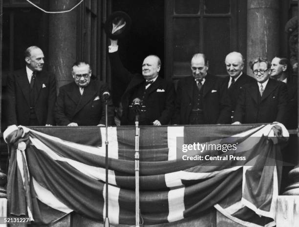 British Prime Minister Winston Churchill addresses the crowds from the balcony of the Ministry of Health in Whitehall on VE Day, 8th May 1945. From...
