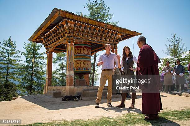 Prince William, Duke of Cambridge and Catherine, Duchess of Cambridge chat to a monk on the trek up to Tiger's Nest during a visit to Bhutan on the...