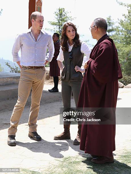 Prince William, Duke of Cambridge and Catherine, Duchess of Cambridge chat to a monk on the trek up to Tiger's Nest during a visit to Bhutan on the...