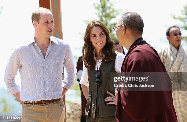 Prince William, Duke of Cambridge and Catherine, Duchess of Cambridge chat to a monk on the trek up to Tiger's Nest during a visit to Bhutan on the...