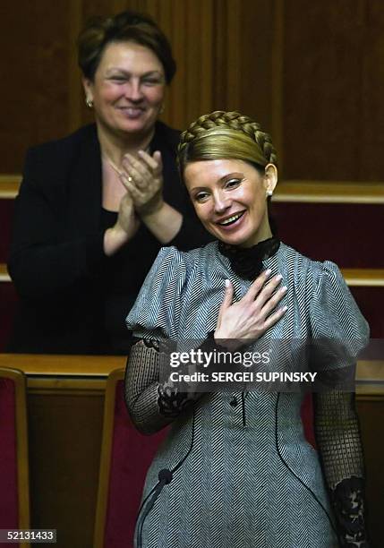 Yulia Timoshenko reacts 04 February 2005 after being confirmed by the Ukrainian Parliament in Kiev as prime minister. The parliament had been...