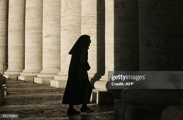 Nun walks in Saint-Peter's square at the Vatican 04 February 2005. Pope John Paul II's condition has improved and he is eating regularly, Vatican...