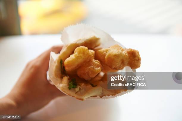 pastry wrapped youtiao - youtiao stock pictures, royalty-free photos & images