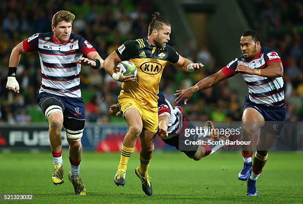 Cory Jane of the Hurricanes beats the Rebels defence to score a try during the round eight Super Rugby match between the Rebels and the Hurricanes at...