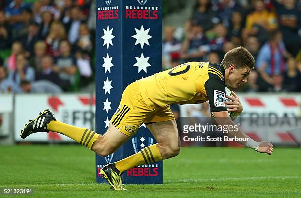 Beauden Barrett of the Hurricanes scores a try during the round eight Super Rugby match between the Rebels and the Hurricanes at AAMI Park on April...