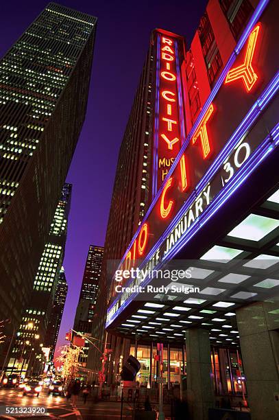 radio city music hall and skyscrapers - music hall center stock pictures, royalty-free photos & images