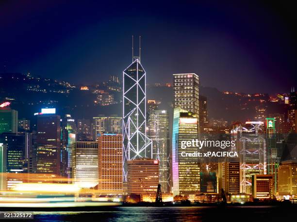 an old style hong kong junk boat sails at night - hong kong junk boat stock-fotos und bilder