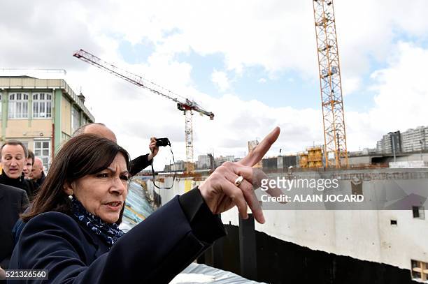 Mayor of Paris Anne Hidalgo visits the building site of the "Hotel logistique Chapelle International", part of a new urban and logistical...