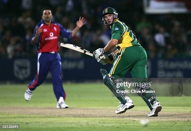 Graeme Smith of South Africa scores a four off the bowling of Kabir Ali of England during the third one day international match between South Africa...