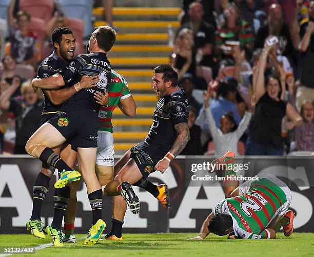 Justin O'Neil of the Cowboys celebrates with Michael Morgan of the Cowboys after scoring a try during the round seven NRL match between the North...