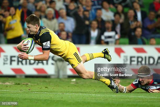 Beauden Barrett of the Hurricanes scores a try during the round eight Super Rugby match between the Rebels and the Hurricanes at AAMI Park on April...