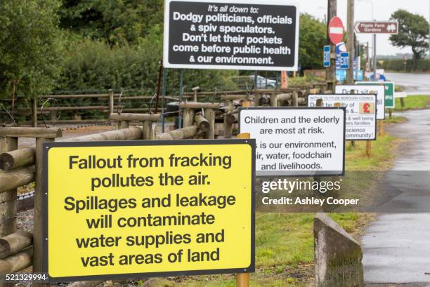 a protest banner against fracking at a farm site at little plumpton near blackpool, lancashire, uk - fracking fotografías e imágenes de stock