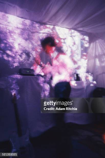 Syd Barrett of Pink Floyd performs under psychedelic lighting at the Architectural Association student party, London, 16th December 1966.