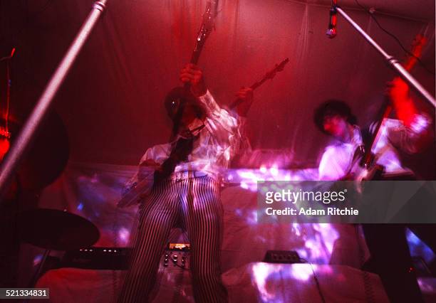 Roger Waters and Syd Barrett of Pink Floyd perform under a psychedelic light show at the Architectural Association student party, London, 16th...