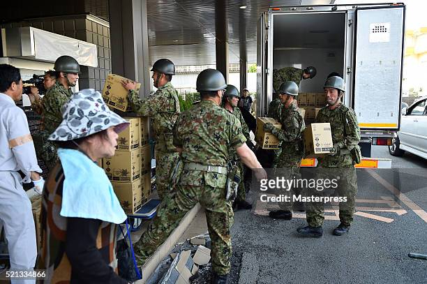 Japan Self-Defense Forces carry relief supplies a day after the 2016 Kumamoto Earthquake at the Mashiki Town Hall on April 15, 2016 in Mashiki,...